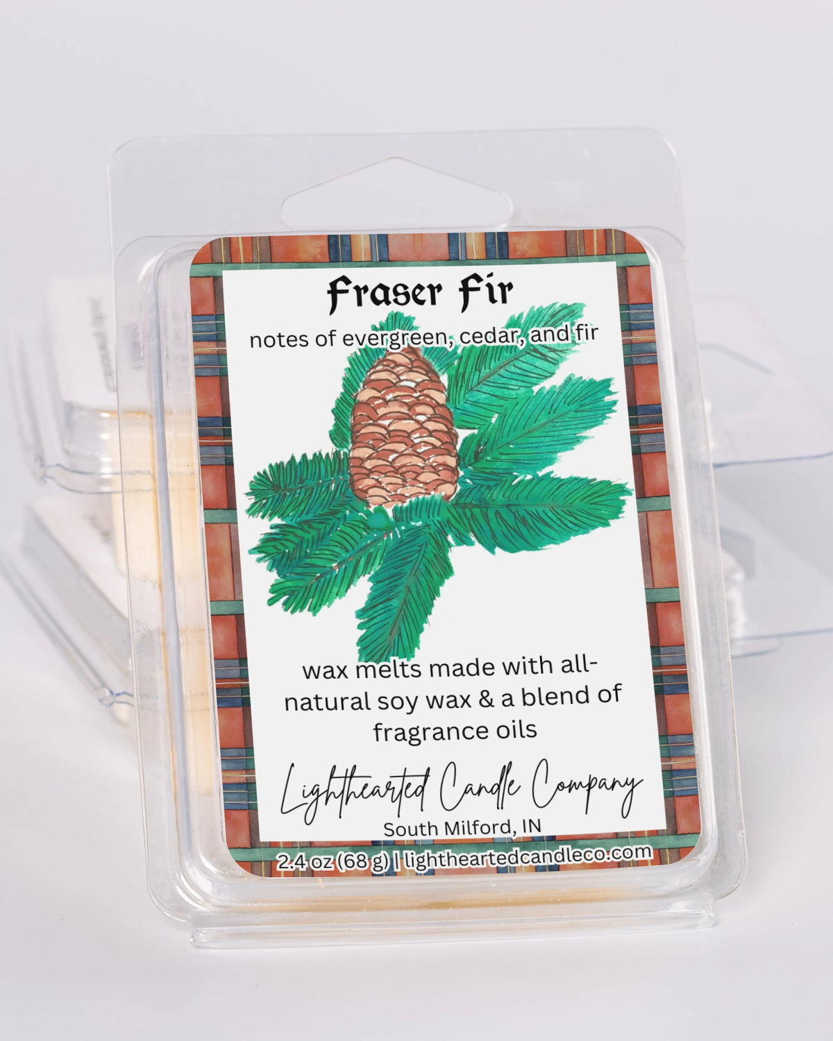 Fraser Fir Wax Melt clamshells stacked at an angle on a pale background, alternate view 5