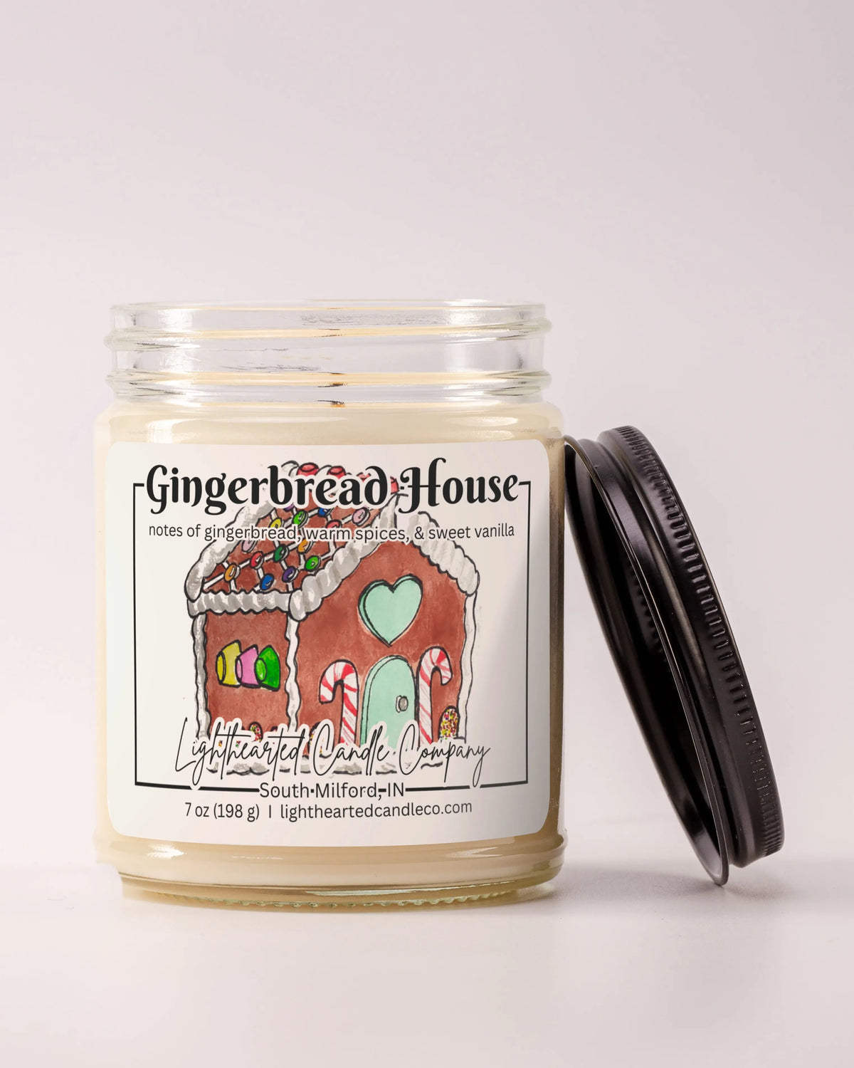 Alternate view Gingerbread House Candle in a clear glass jar with original watercolor artwork and a metal lid