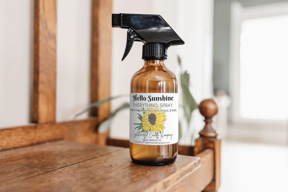 Hello Sunshine Everything Spray on a wooden dresser in a bright bedroom
