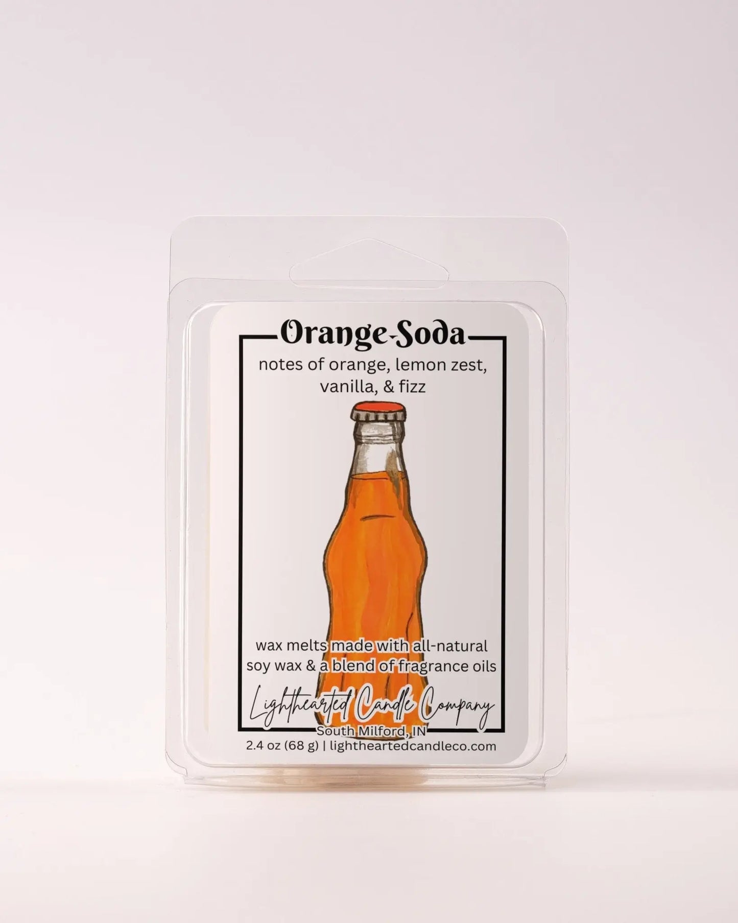 Single Orange Soda Wax Melt 2.4 oz clamshell on a pale background