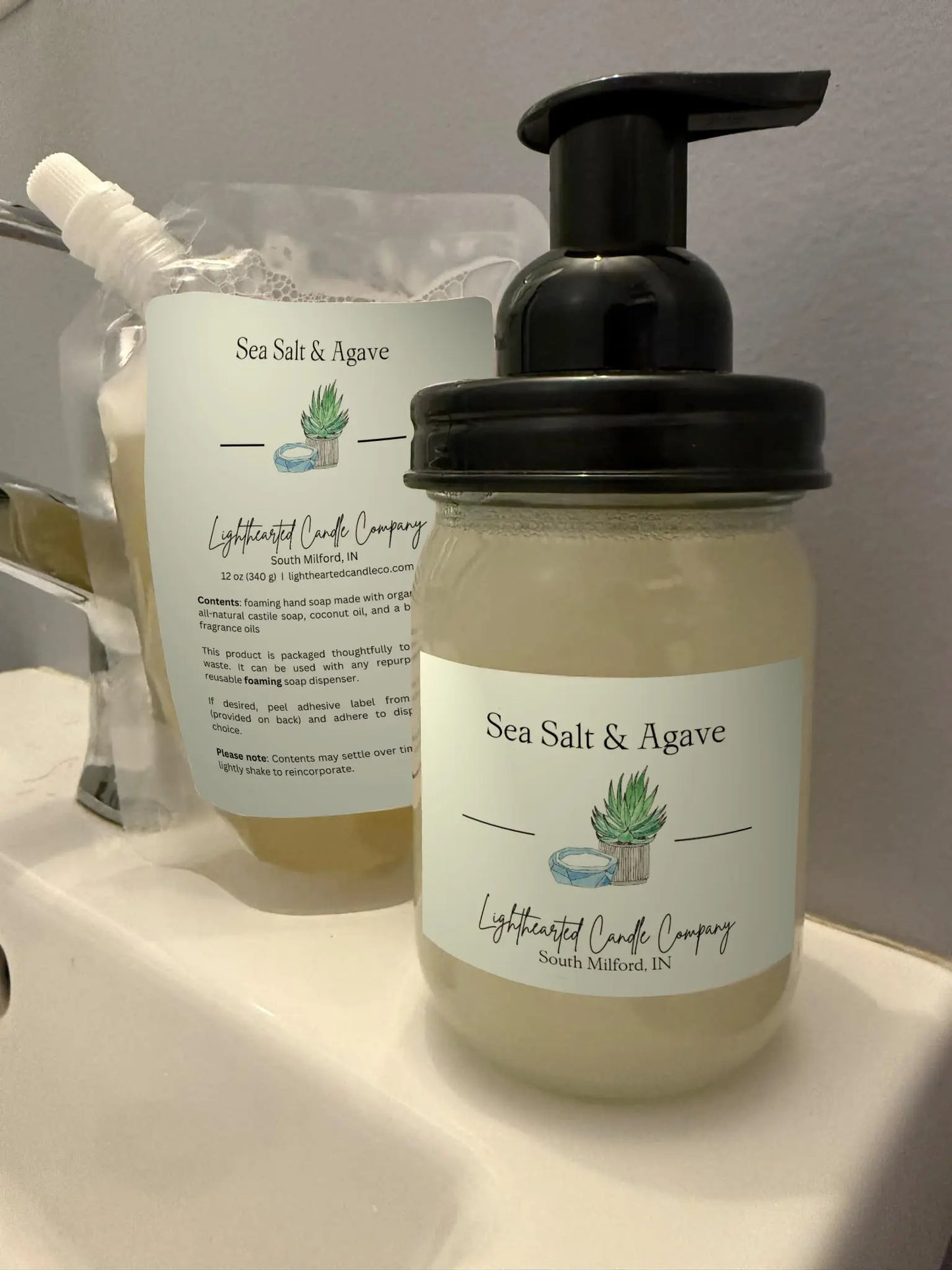 Sea Salt & Agave foaming soap refill pouch and filled glass foaming dispenser shown together