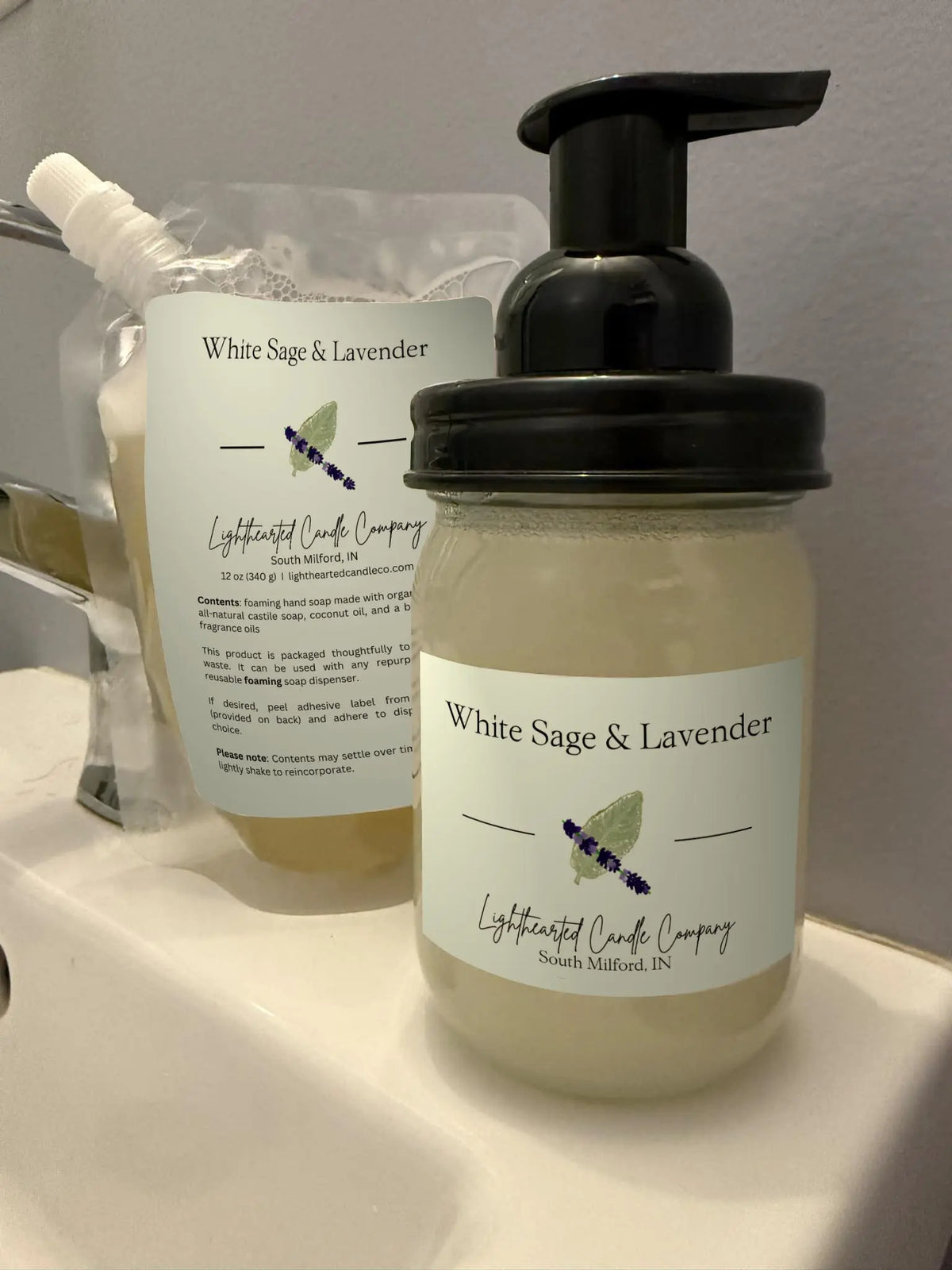 White Sage & Lavender foaming soap refill pouch and filled glass foaming dispenser shown together