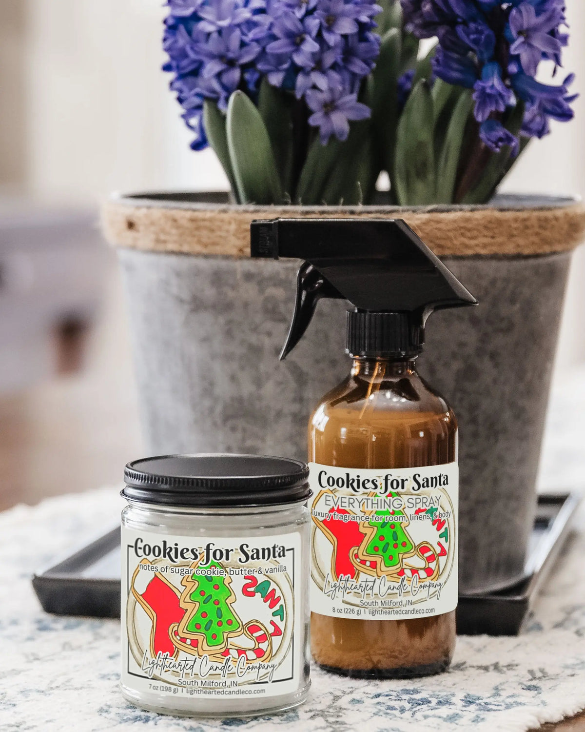 Closed Cookies for Santa Candle in a clear glass jar with a black metal lid