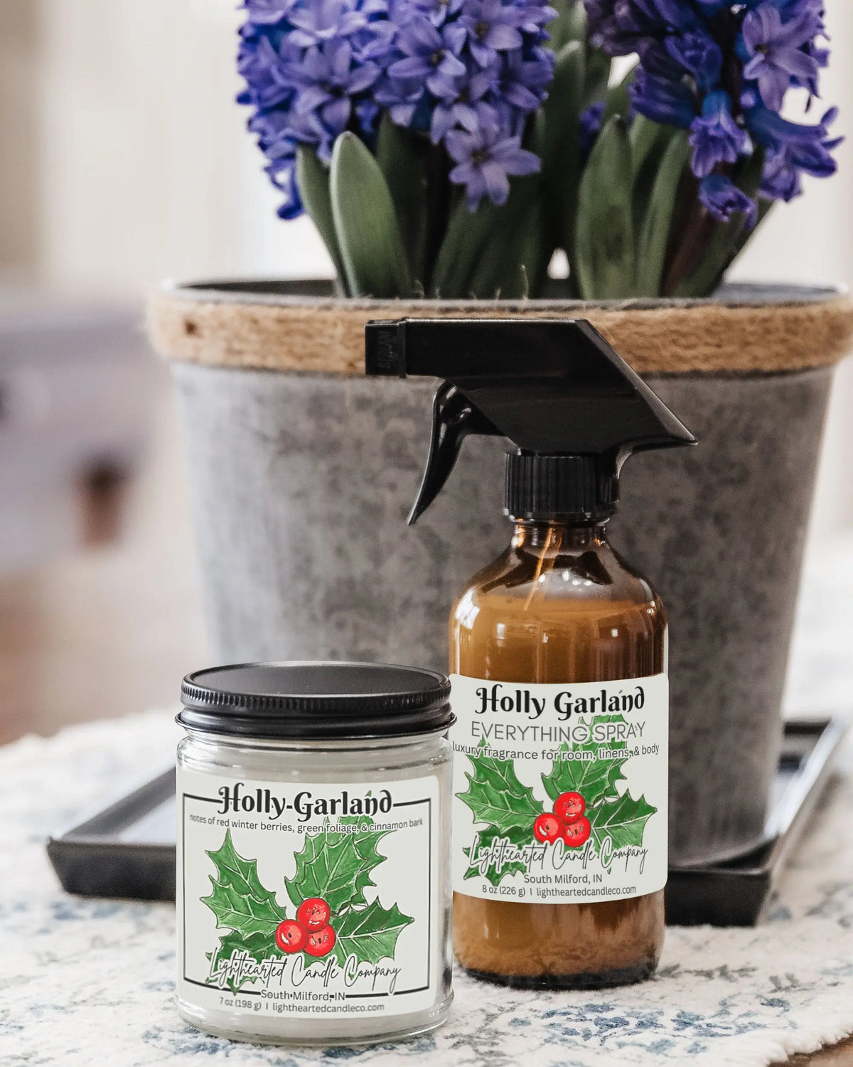 Alternate view Holly Garland Candle in a clear glass jar with original watercolor artwork and a metal lid