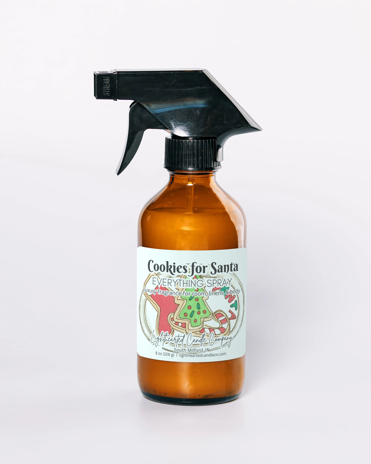 Cookies for Santa Everything Spray in an amber glass bottle on a pale background