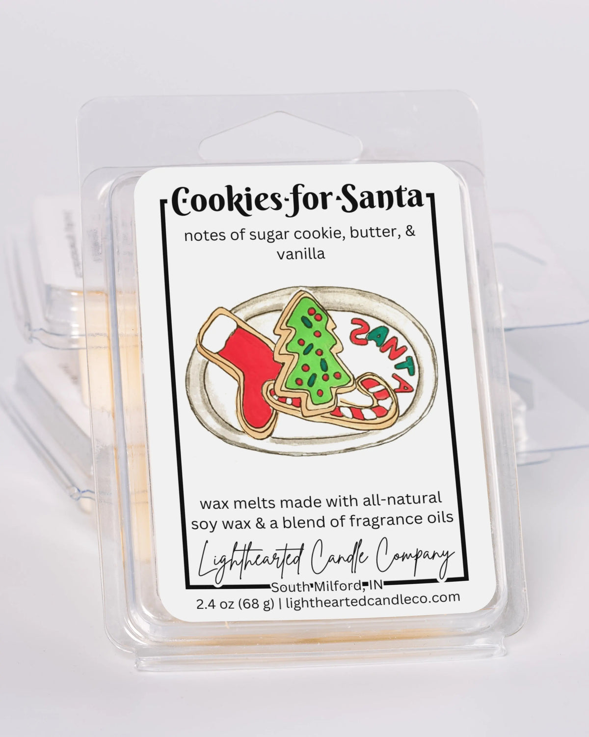 Cookies for Santa Wax Melt clamshells stacked at an angle on a pale background