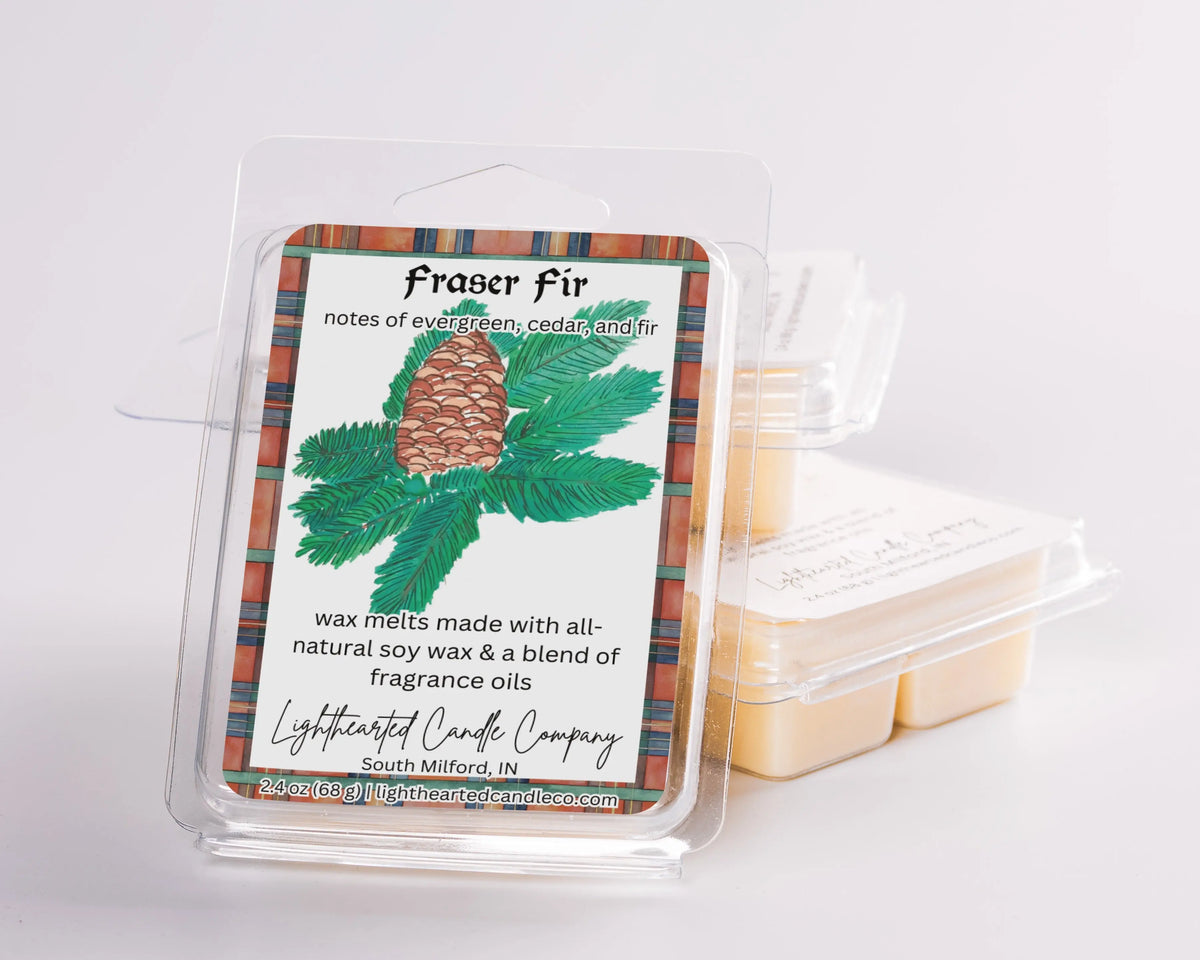 Fraser Fir Wax Melt clamshells arranged in a stack on a pale background, alternate view 4