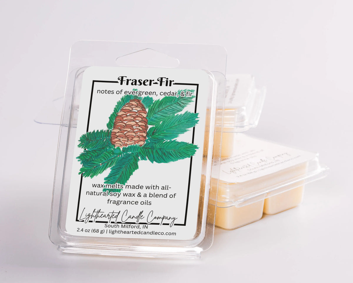 Fraser Fir Wax Melt clamshells arranged in a stack on a pale background