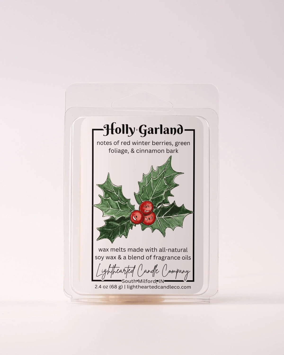 Single Holly Garland Wax Melt 2.4 oz clamshell on a pale background