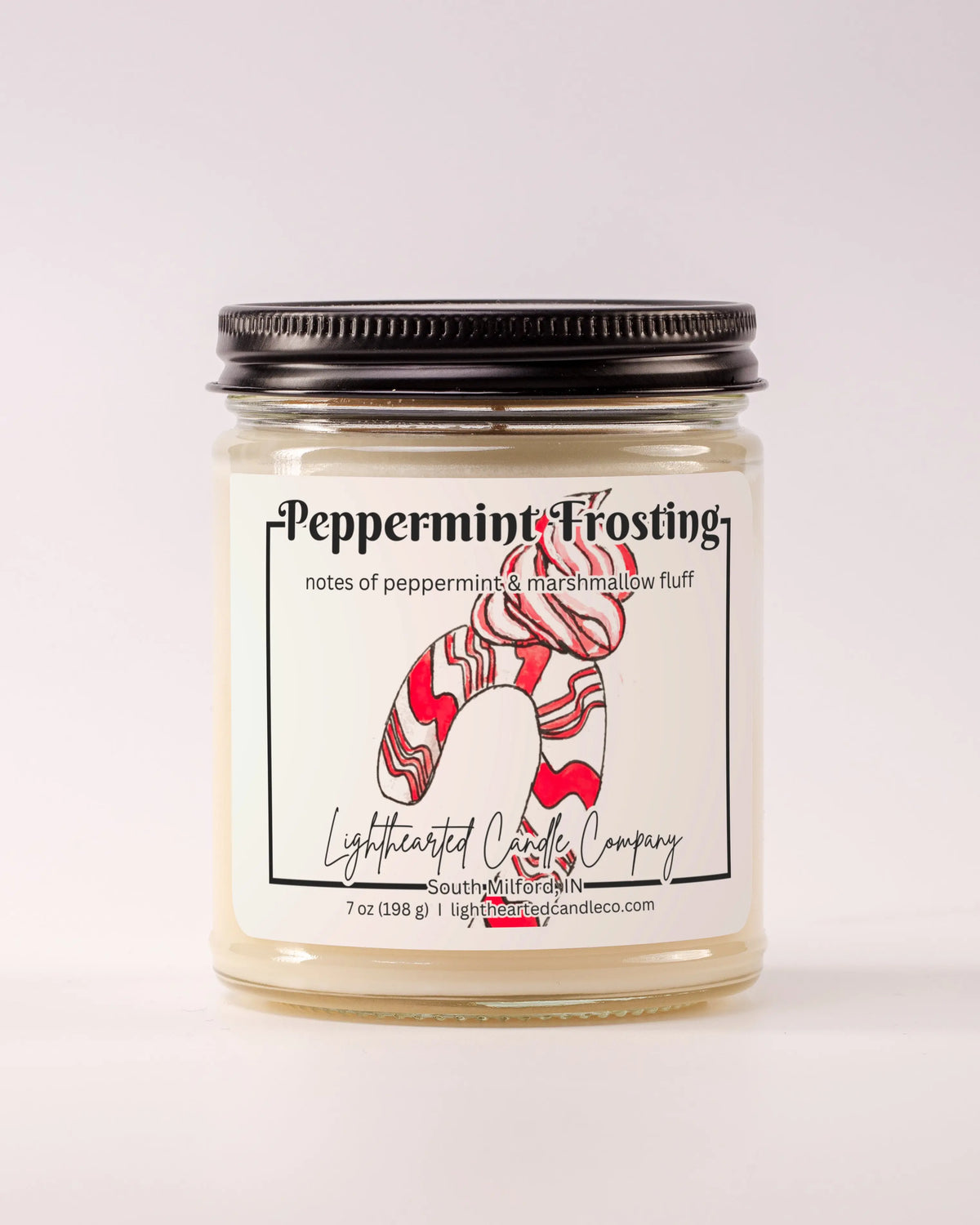 Closed Peppermint Frosting Candle in a clear glass jar with a black metal lid