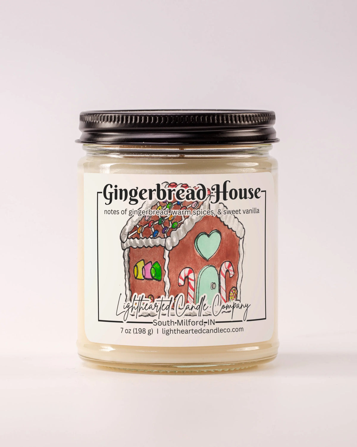 Alternate view Gingerbread House Candle in a clear glass jar with original watercolor artwork and a metal lid