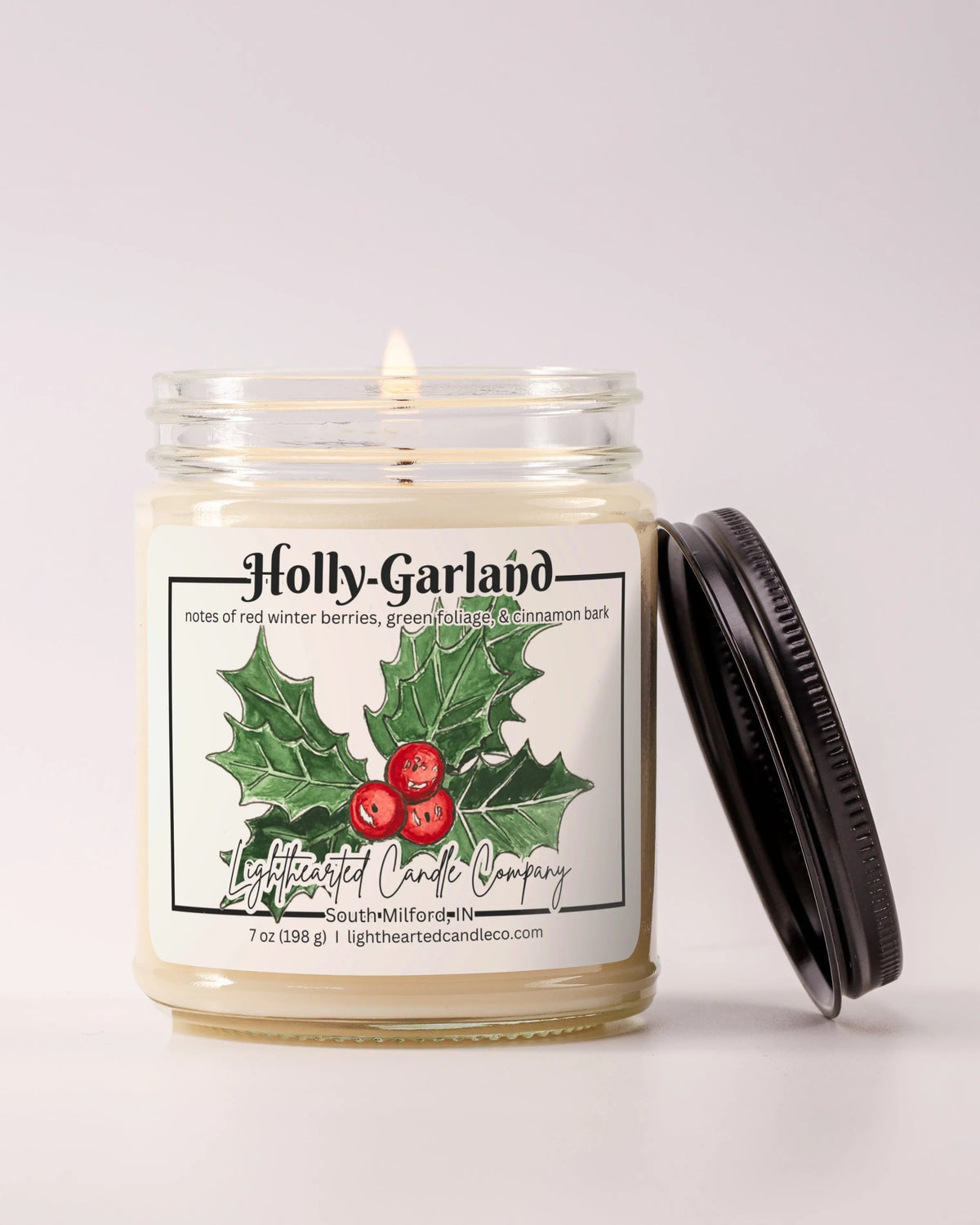 Alternate view Holly Garland Candle in a clear glass jar with original watercolor artwork and a metal lid