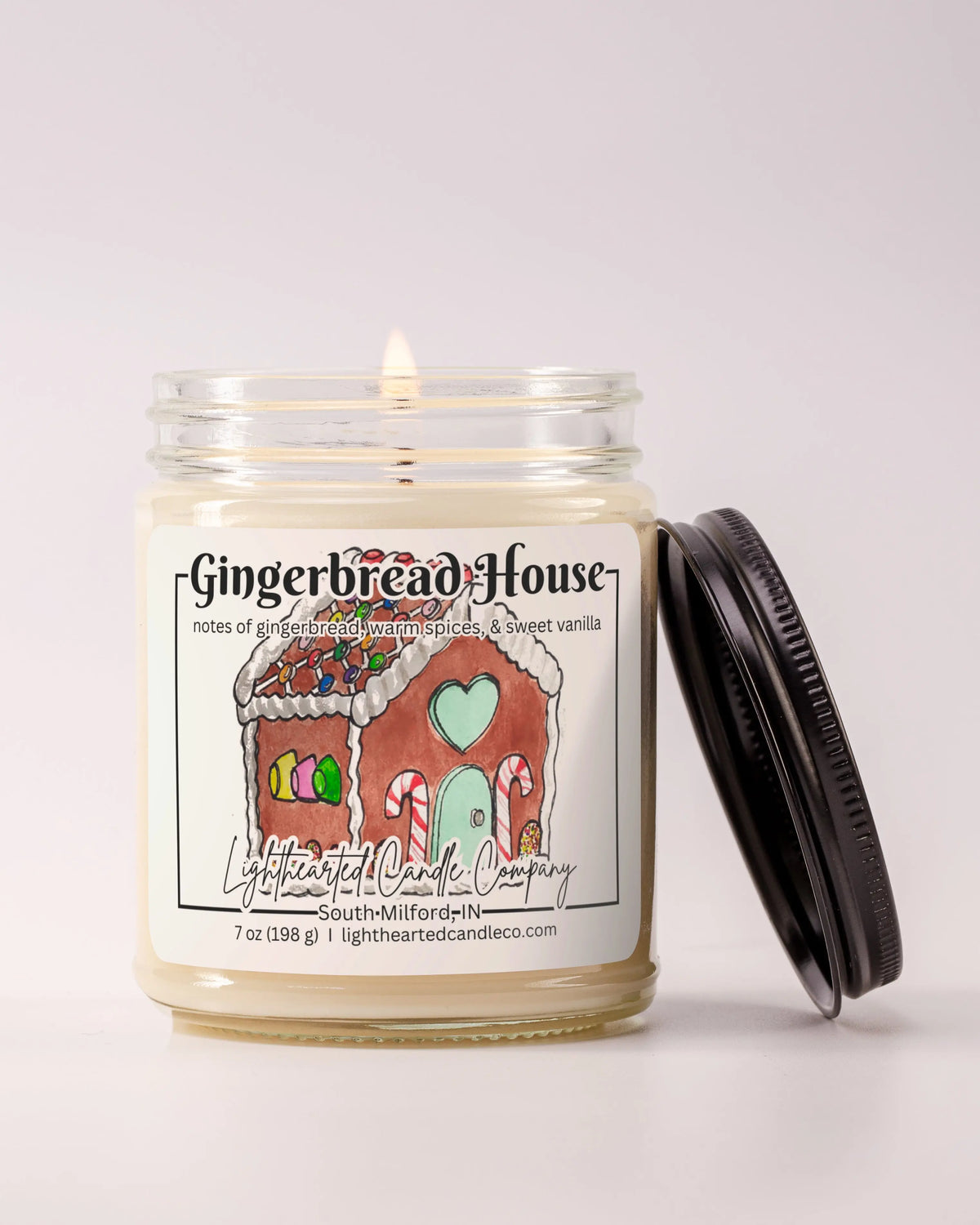 Alternate view Gingerbread House Candle in a clear glass jar with original watercolor artwork and a metal lid