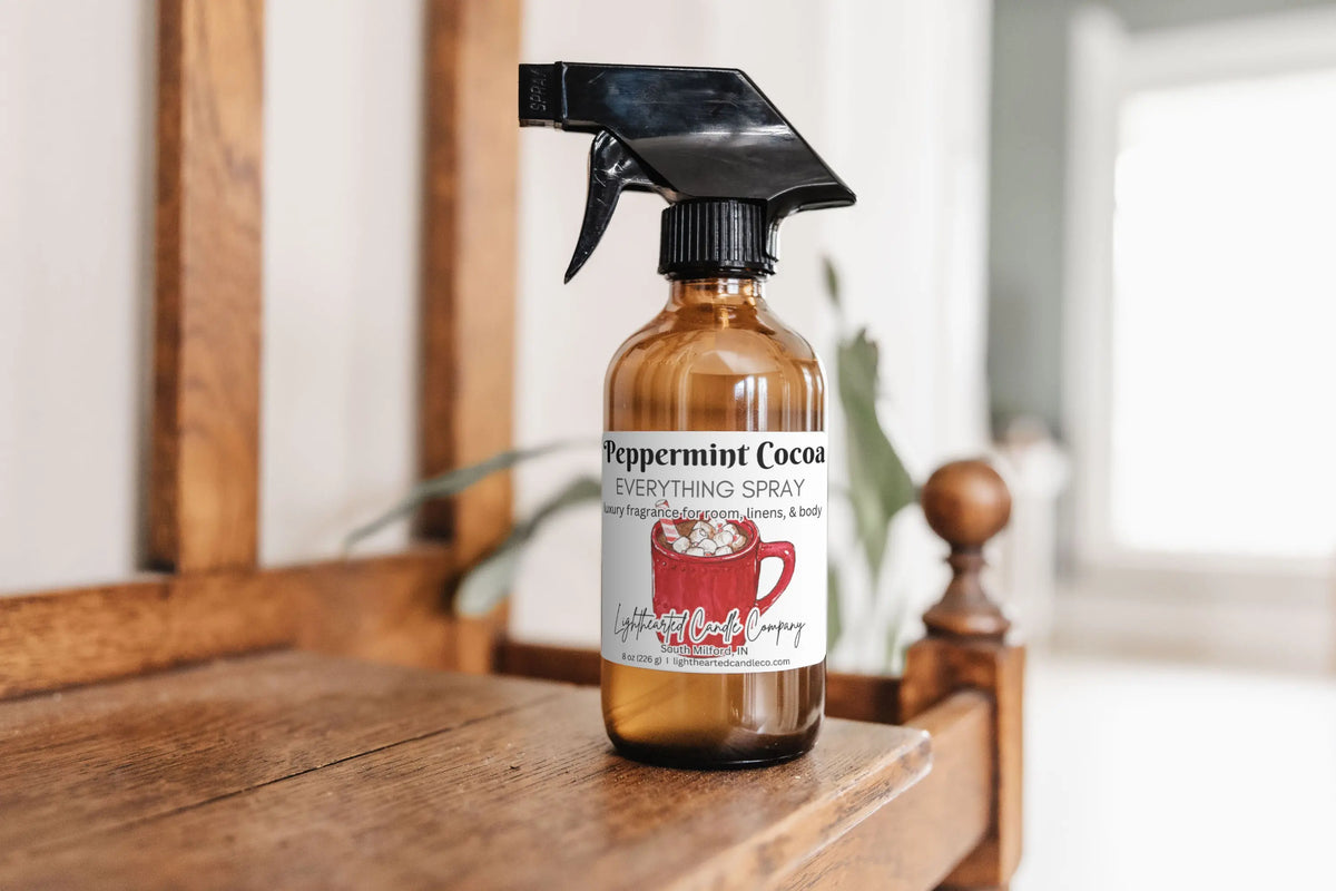Peppermint Cocoa Everything Spray on a wooden dresser in a bright bedroom