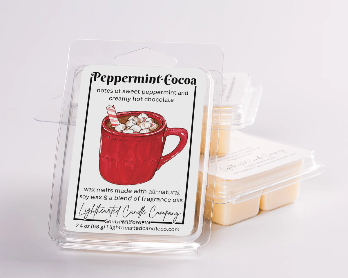 Peppermint Cocoa Wax Melt clamshells arranged in a stack on a pale background