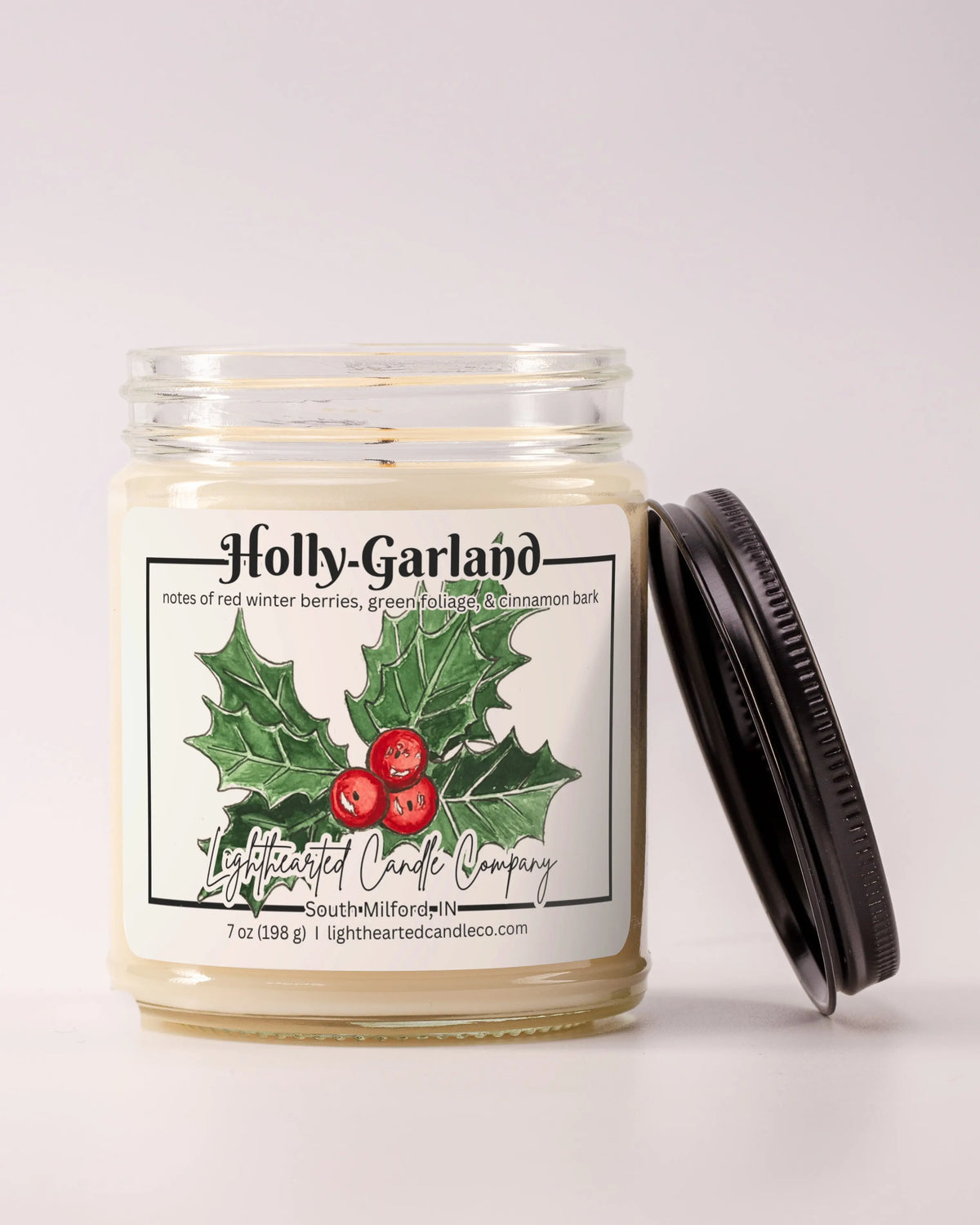 Alternate view Holly Garland Candle in a clear glass jar with original watercolor artwork and a metal lid