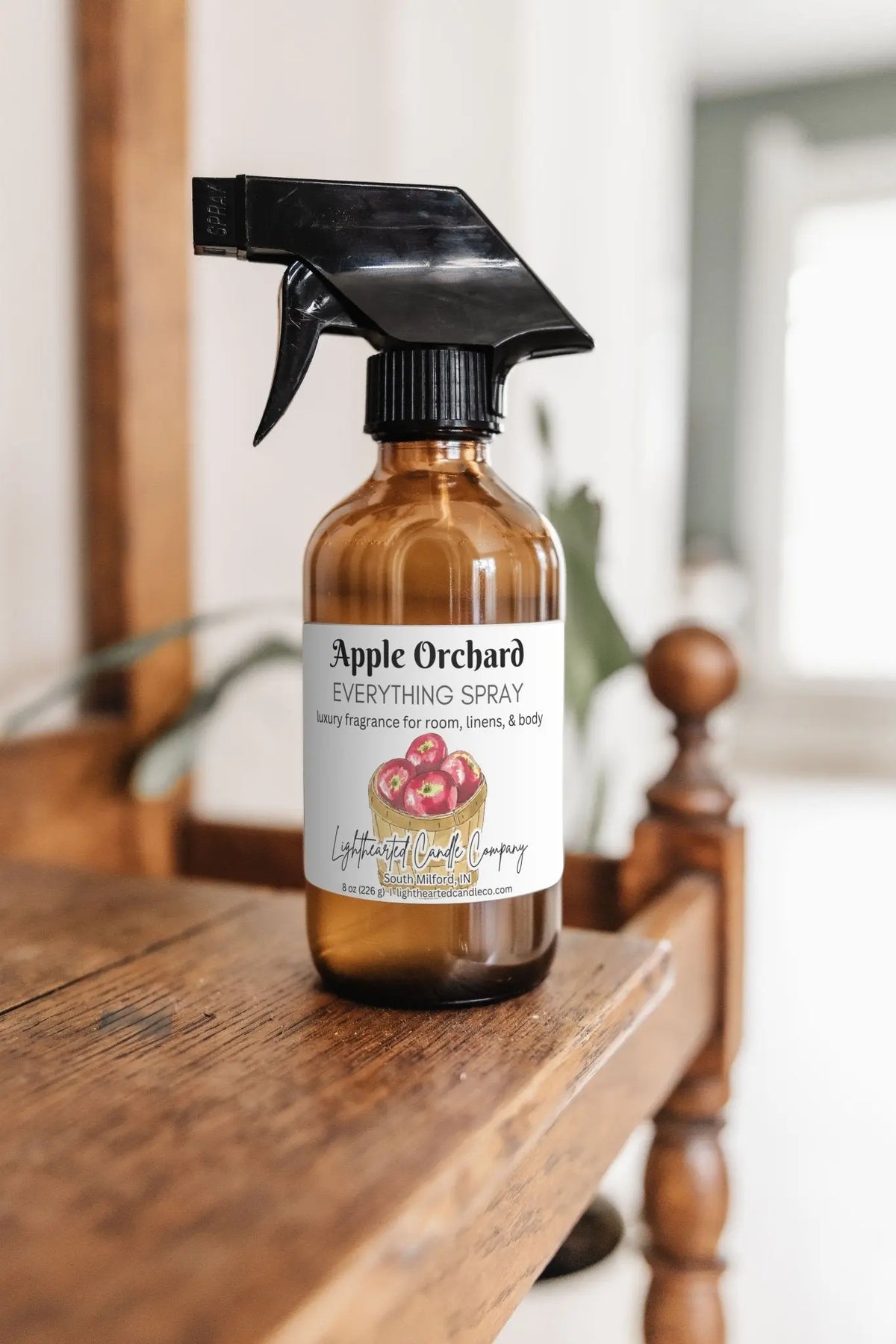 Apple Orchard Everything Spray in an amber glass bottle on a light background