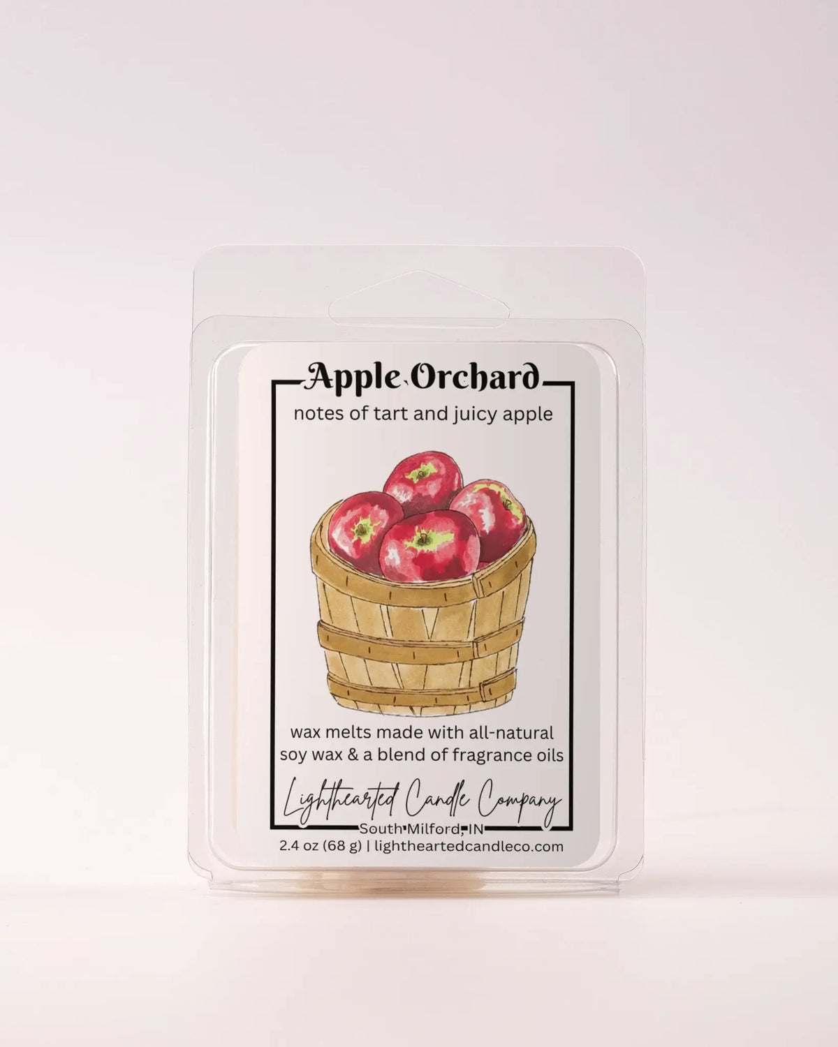 Apple Orchard Wax Melt clamshells arranged in a stack on a pale background, alternate view 2