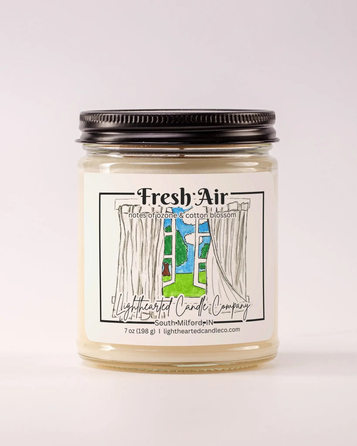 Closed Fresh Air Candle in a clear glass jar with a black metal lid