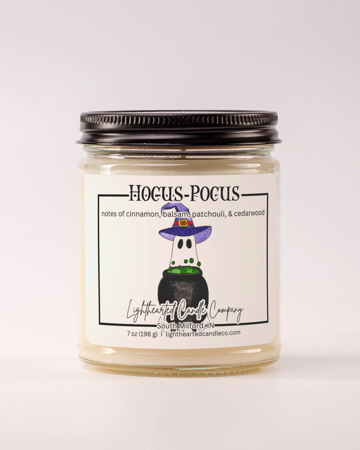 Closed Hocus Pocus Candle in a clear glass jar with a black metal lid