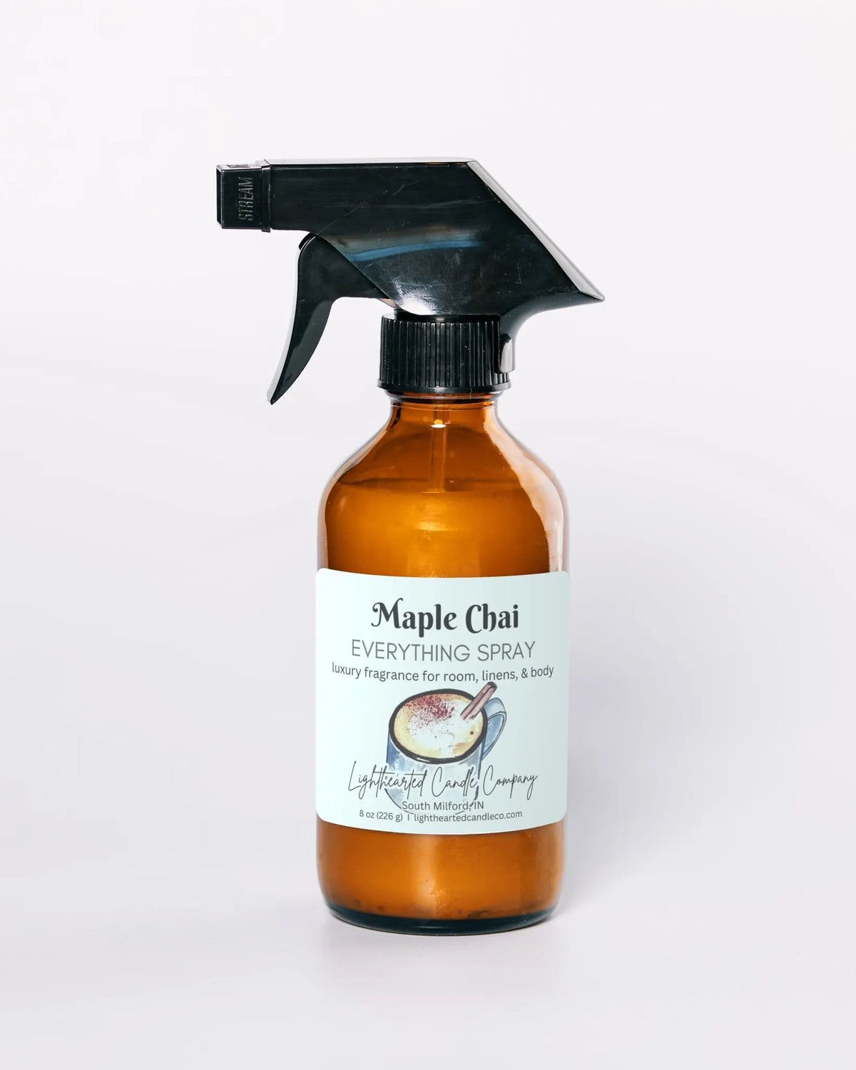 Maple Chai Everything Spray in an amber glass bottle on a pale background