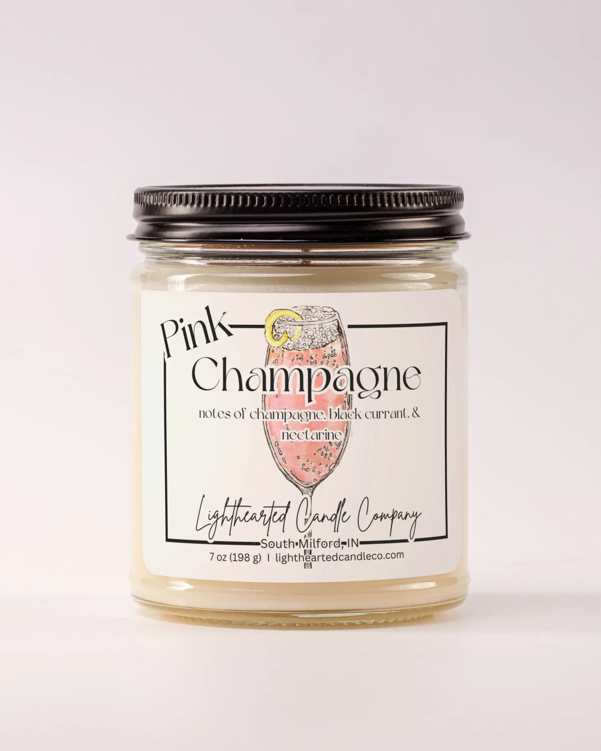 Closed Pink Champagne Candle in a clear glass jar with a black metal lid
